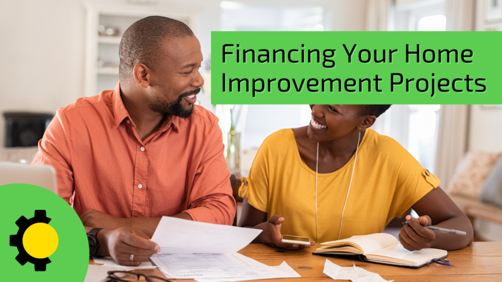 Smiling couple reviewing home improvement finances with papers and phone at a dining table, next to a large text reading 'Financing Your Home Improvement Projects.